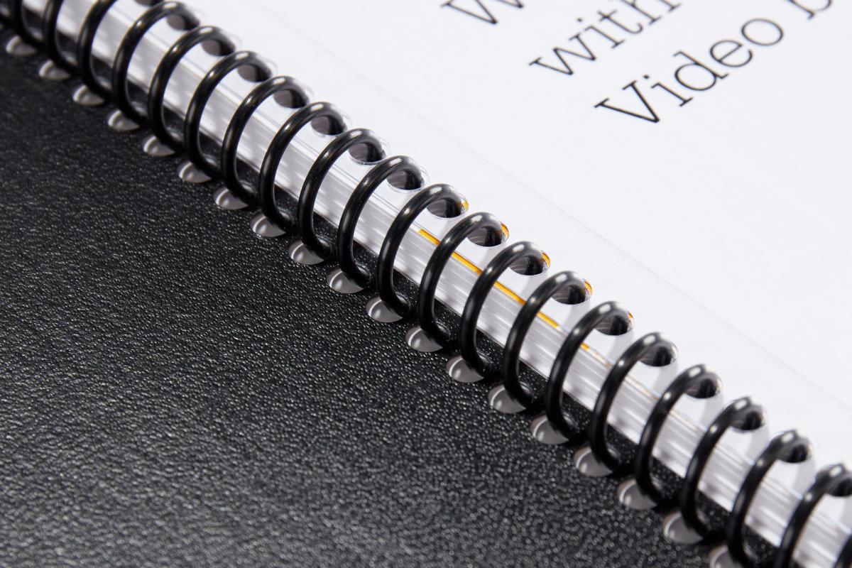 Close-up of the spine on a spiral-bound notebook